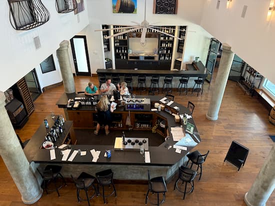 Judy, with Shane and Ranita, enjoying a tasting while I am off taking pictures