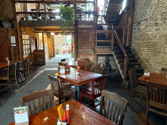 A cozy table inside the Gristmill River Restaurant