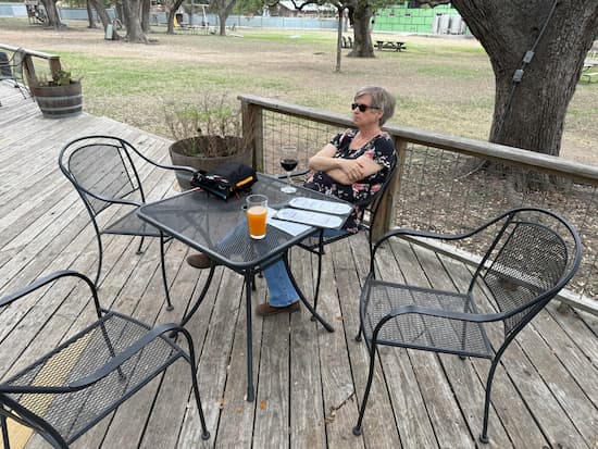 Judy enjoying her wine at Wimberley Valley Winery.